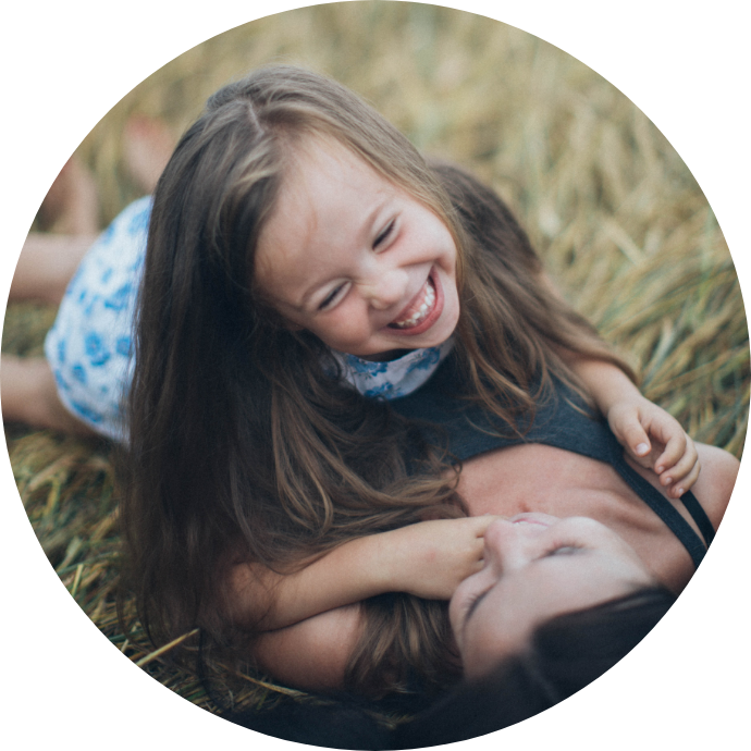 Photo of a mom and daughter laughing